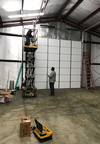 Technician repairing a garage door